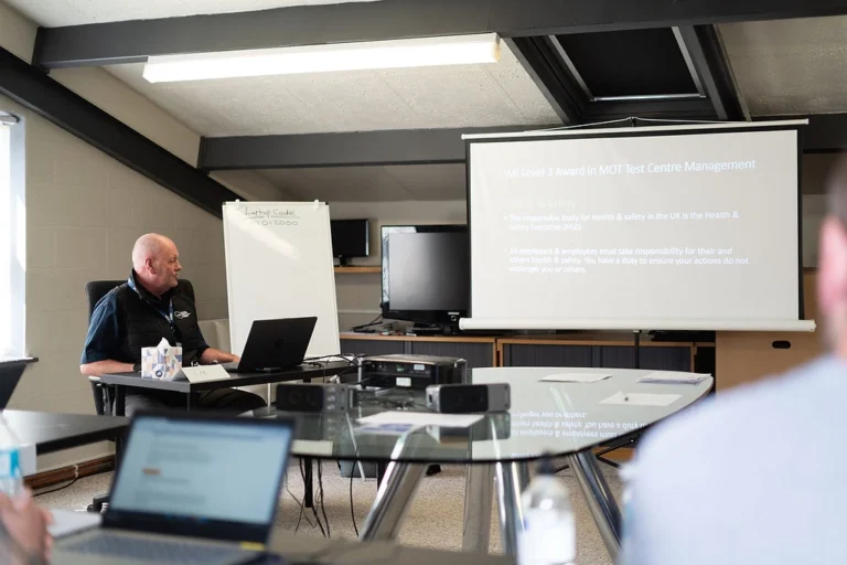 VOCS instructor presenting course materials to attendees in a classroom